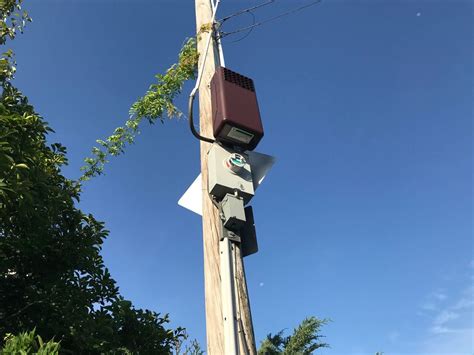 electrical box on telephone pole|strange boxes on utility poles.